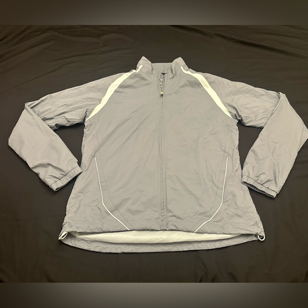Under Armour golf wear women’s grey/white full zip jacket. Size small.